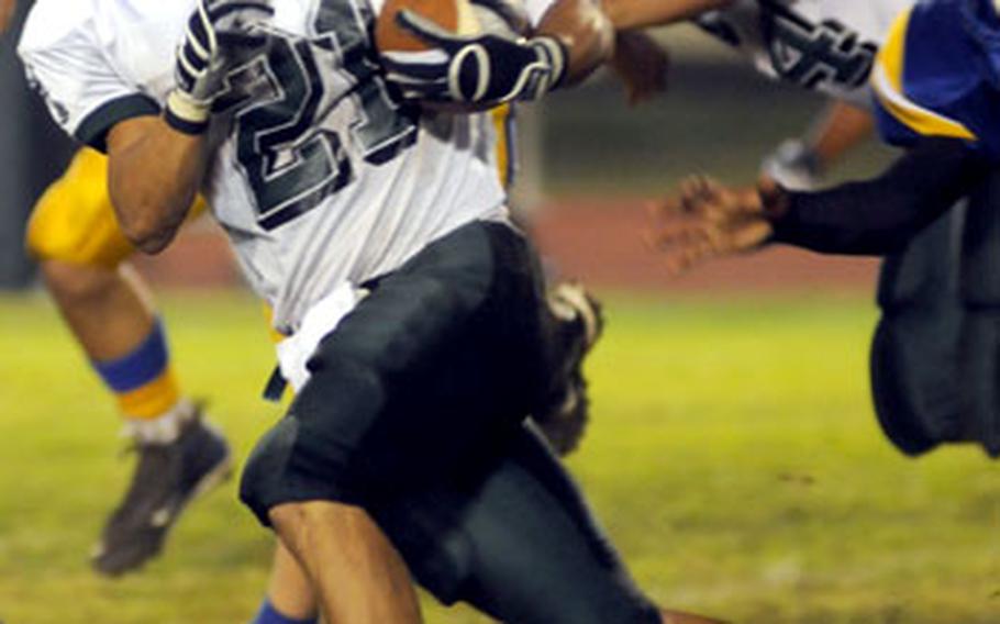 Kubasaki running back Josh Bales breaks free for a 45-yard gain against Yokota.