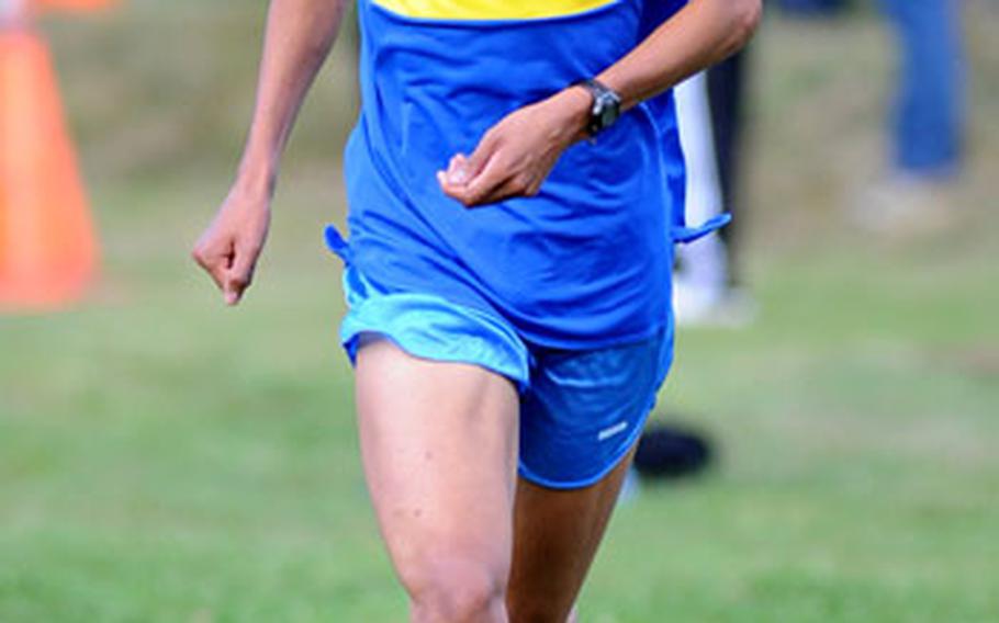 Dan Parker of Wiesbaden heads down the home stretch of the boys' cross country race at Ramstein-Miesenbach on Friday evening. He won the race in 16:36.28, ahead of Ramstein's Thomas Amrine and Carl Lewenhaupt.