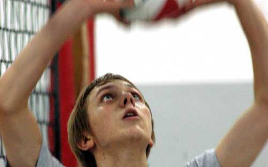 Aviano High School junior Sam Hillestad sets a volleyball during a recent practice. Hillestad, whose parents have both coached the sport at the school, hopes to play in college.