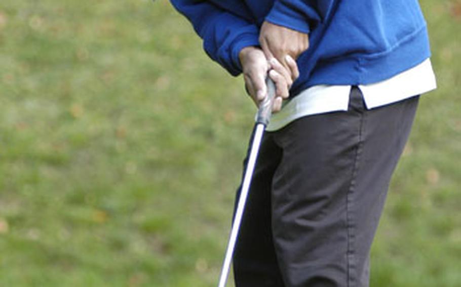 Allen Genido of Rota sinks a putt.