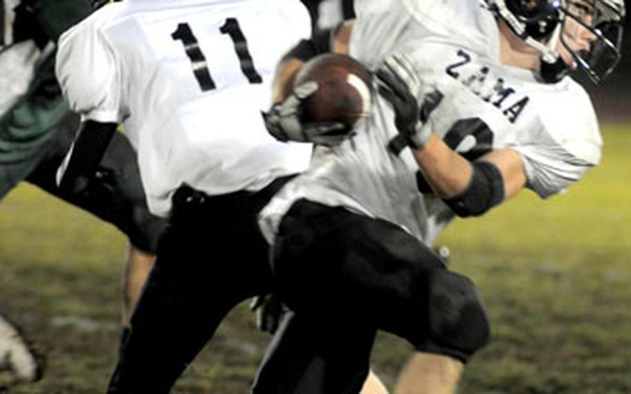 Zama American&#39;s Ashton Norwood skirts right end en route to the game-sealing 30-yard third-quarter touchdown run.