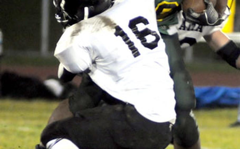 Edgren running back Ja&#39;Maal Dennis gets wrapped up by Zama American defender D.J. Ward.