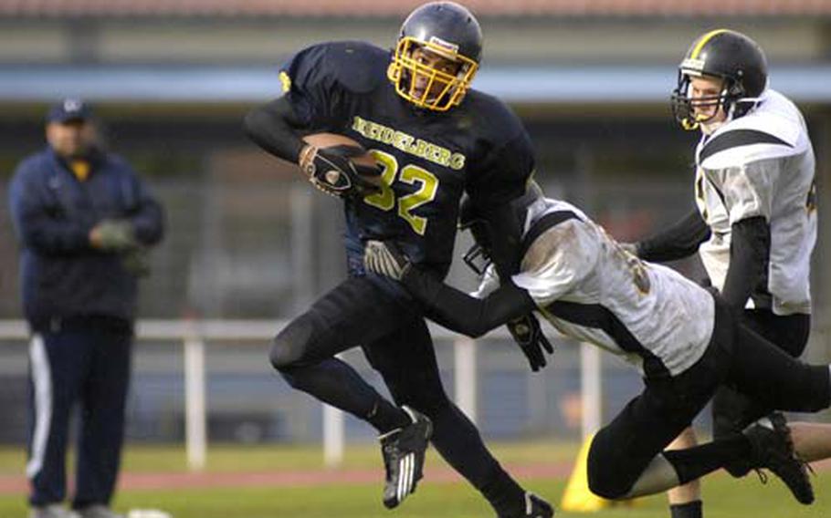 Heidelberg’s Devin Jackson, who rushed nine times for 153 yards and two touchdowns, sets his sights downfield as Aaron Oliver of Patch dives to make the tackle Saturday.