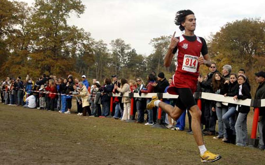 Baudoin Fort of International School of the Brussels stretches his stride across the finish line to clinch the boys Div. I DoDDS European cross country championship held in Schwetzingen near Heidlelberg, Germany. Fort came in second in 2008.