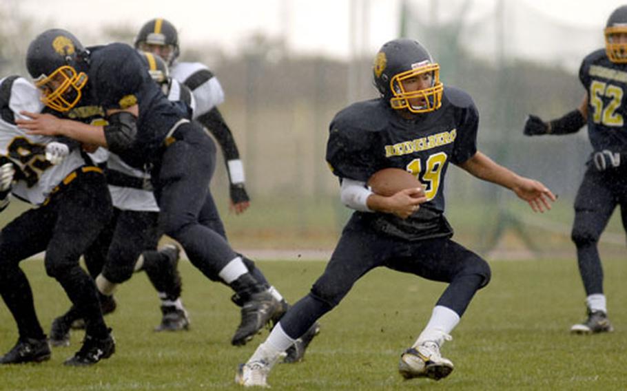 Heidelberg QB Jimmy Montfleury runs the ball against Patch Oct. 17. He will be leading the Lions in the D-I championship game against Ramstein on Saturday.