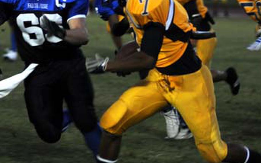 Guam High Panthers running back Jason Brunson (7) looks for running room against Seoul American Falcons defender Steve Brown (69) during Tuesday&#39;s 2009 DODEA Pacific Far East High School Class AA (large schools) football semifinal at Mike Petty Stadium, Kubasaki High School, Camp Foster, Okinawa. Defending champion Seoul American shut out Guam High 15-0 and earned its third Class AA title-game berth Saturday vs. Kadena.