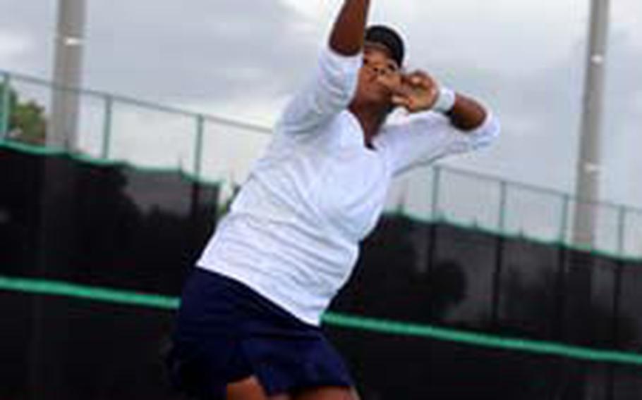 Guam High Panthers junior Amber Gadsden, the No. 3 seed, readies to launch an overhead smash against No. 11 Erika Ettl of Yokota during Tuesday&#39;s singles quarterfinal match in the 2009 DODEA Pacific Far East High School Tennis Tournament at Risner Tennis Complex, Kadena Air Base, Okinawa. Gadsden won 8-1.