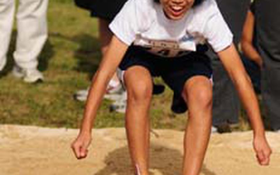 Honoka Taira leaps in the standing long jump at the 10th Annual Special Olympics at the Risner Sports Complex on Saturday. About 900 special-needs athletes converged at Risner Sports Complex to compete, and about 300 special-needs artists displayed artwork. Officials said about 6,000 people showed up to support participants.