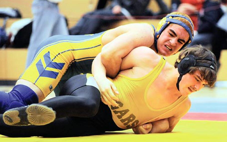 Feb. 14 - Ansbach's Dominic Barrale, top, and Vicenza's Kyle Kaus grapple in the 171-pound final at the DODDS-Europe championships in February. Barrale took the title. Both wrestlers will return for their teams when the season gets under way on Saturday.