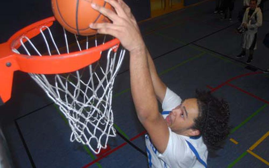 Hohenfels junior Jordan Gaddy goes above the rim during a Tuesday practice session in Hohenfels, Germany. In his first two games with Hohenfels last week, the 6-foot-5 Gaddy totaled 47 points.