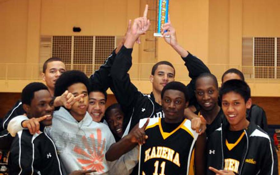 Kadena Panthers players celebrate with the championship trophy after Sunday&#39;s championship game in the 4th New Year Classic high school basketball tournament at George I. Purdy Fitness & Sports Center, Yokosuka Naval Base, Japan. Kadena beat host Nile C. Kinnick 71-67 for its second tilte in the tournament&#39;s brief history.