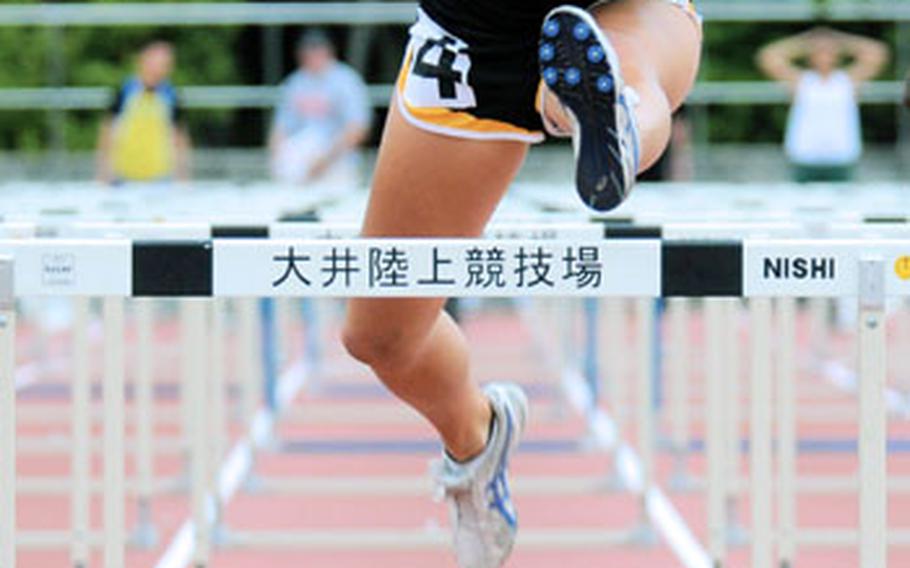American School In Japan senior Gwen Thornton runs the 100 hurdles during the Kanto Plain Invitational Track and Field Meet at Oi Pier Ground, Tokyo. Thornton closed her career, winning the hurdles in 15.98, one of four golds she won on the day, two of them in league- and meet- record time.