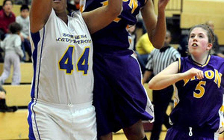 Mannheim&#39;s Kadedra Lea, right, knocks the ball loose from Bamberg&#39;s Mary Marshall, but is called for a foul.