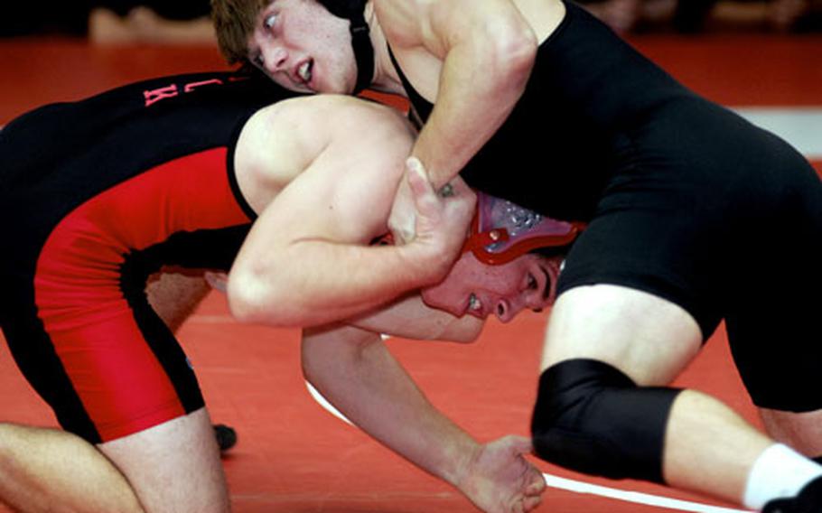 Michael Spencer of Zama American gets the upper hand on Nick Gibbons of Nile C. Kinnick during Saturday&#39;s 168-pound gold-medal bout. Spencer decisioned Gibbons 2-0.