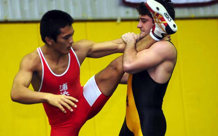 Kadena&#39;s Harry Bloom, right, gets Tatsushi Miyagi of Urasoe Industrial up on one leg during the 158-pound bout in Saturday&#39;s 4th Okinawa-American Friendship Wrestling Tournament at Panther Pit, Kadena High School, Kadena Air Base, Okinawa. Bloom lost a two-period decision to Miyagi, who won the weight class; Bloom beat Miyagi for the 148-pound title last year.