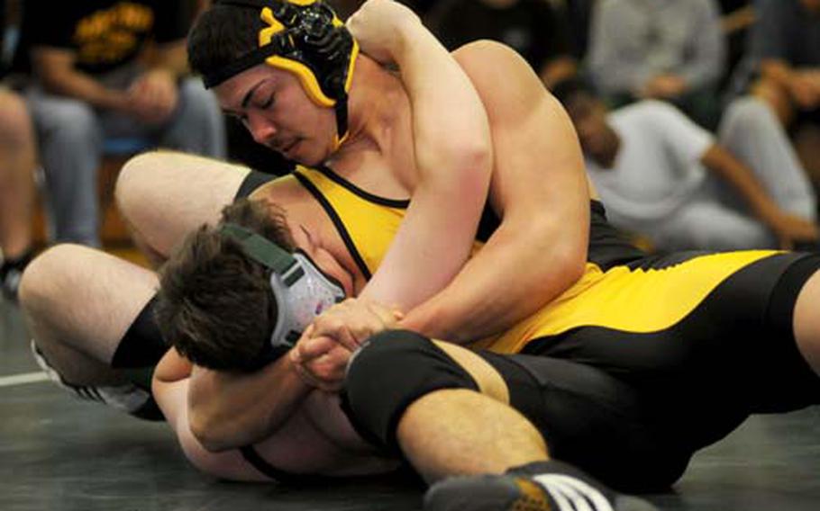 Kadena Panthers junior 215-pound wrestler Aaron Ahner, shown pinning Kind Smith of Kubasaki in Saturday&#39;s 4th Okinawa-American Friendship Wrestling Tournament at Kadena. Ahner, in just his first year of wrestling, is 7-3 so far with two bronze medals in as many tournaments. He&#39;s better known for his powerful left leg in football and soccer.