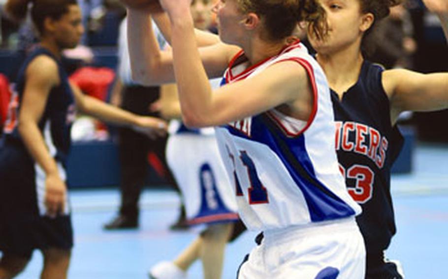 Ramstein freshman Sarah Szbyist looks for a shot during the Lady Royals’ 47-33 victory Friday night. Szybist scored 12 points to tie senior teammate Nadia Booker for game scoring honors.