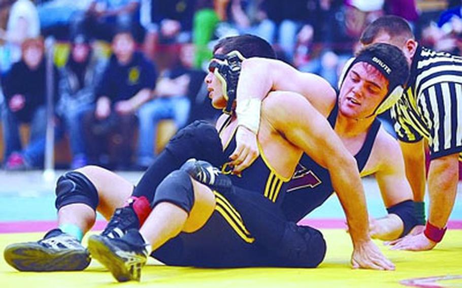 Vilseck’s Tyler Hall, right, wrestles with Patch’s Joe Witherington in the 160-pound final of the 2009 DODDS-Europe wrestling championships. Hall took the title and will be out to defend his crown in the same weight division in this year’s tournament.