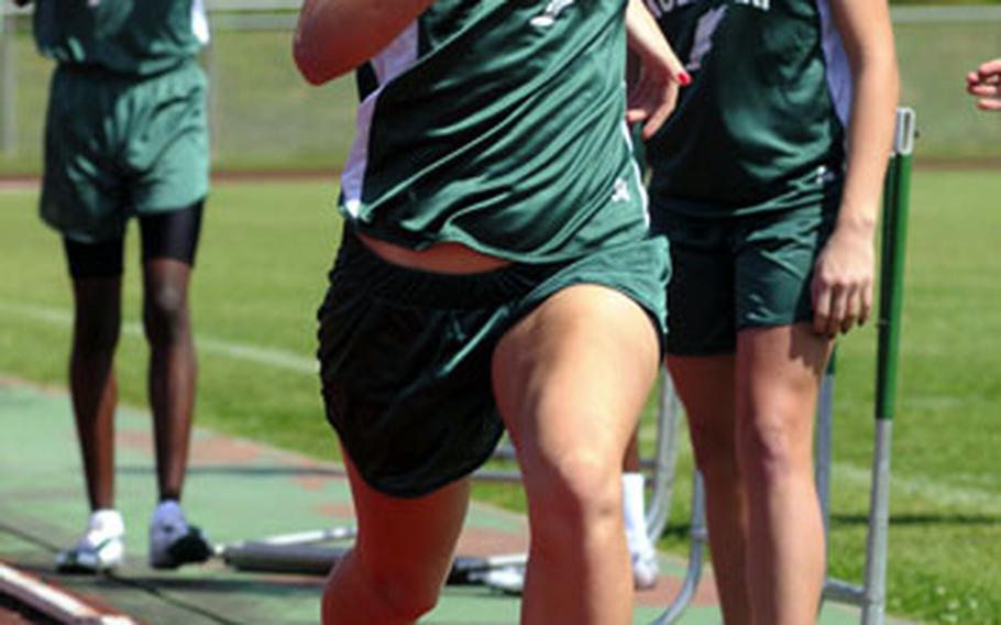 Kubasaki sophomore Jessica Powell grimaces as she nears the finish of the 3,200-meter relay during Saturday’s Okinawa Activities Council season-opening track and field meet at Camp Foster. Powell and Kubasaki won in 11 minutes, 18.40 seconds.