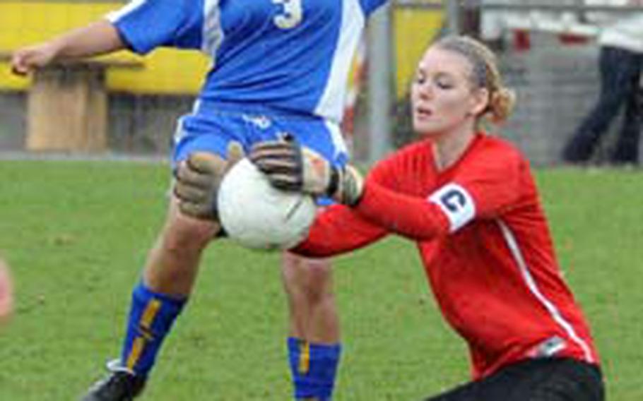 Vilseck goalie Angela Swann pulls in the ball before Wiesbaden&#39;s Iris Freeman can reach it. The game, the season-opener for both teams, ended 1-1.