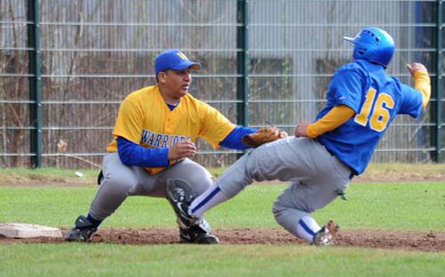 Wiesbaden third baseman Anthony Brown, left, puts the tag on Bamberg&#39;s Kevinn Asahan as he attempts to steal third. Wiesbaden won the game, the first of a season-opening doubleheader, 10-7 on Saturday.