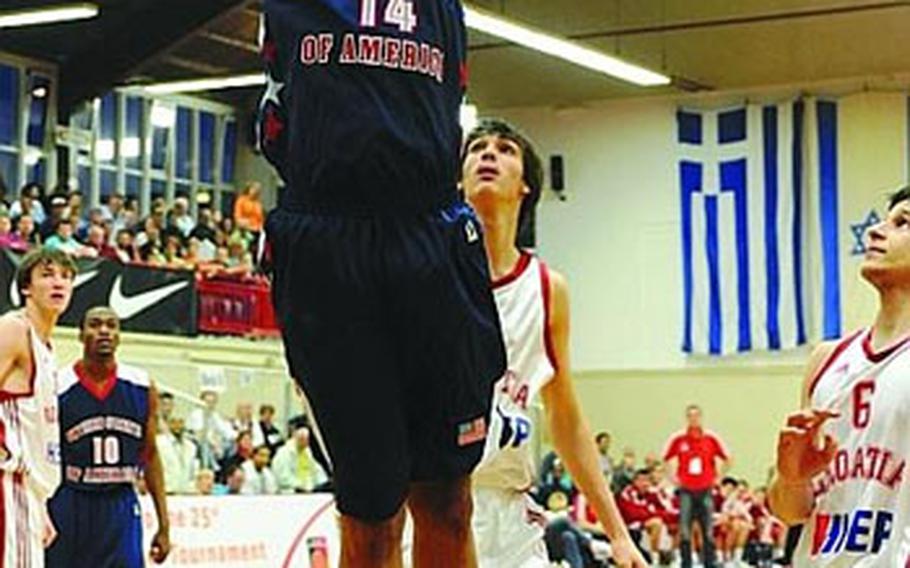 Michael Chandler of the U.S. gets past Croatia’s Dario Saric in the Albert Schweitzer tournament in Mannheim, Germany, on Saturday night. The U.S. beat Croatia 71-69 in their first game of the tournament.