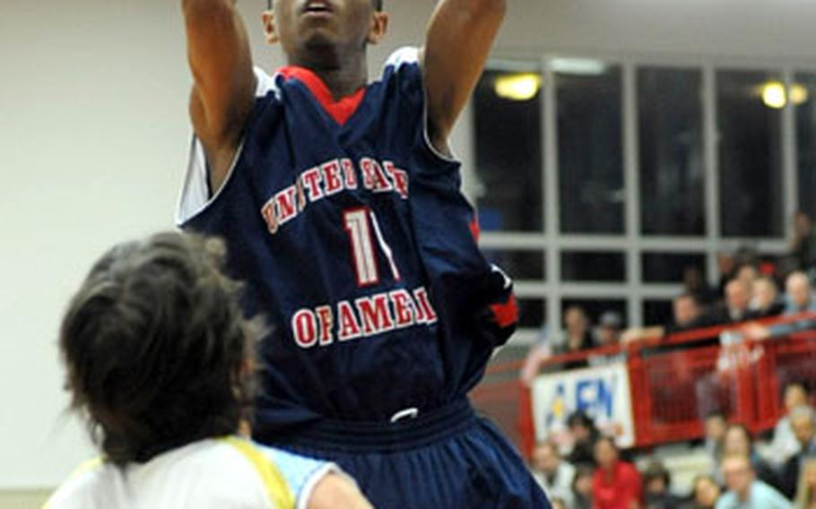 Ryan Boatright of the United States shoots over Argentina&#39;s Pablo Ignacio Perez Monday night. Boatright scored 21 points in the Americans&#39; 61-53 win. The U.S. at 2-1 will face undefeated Spain Wednesday night.