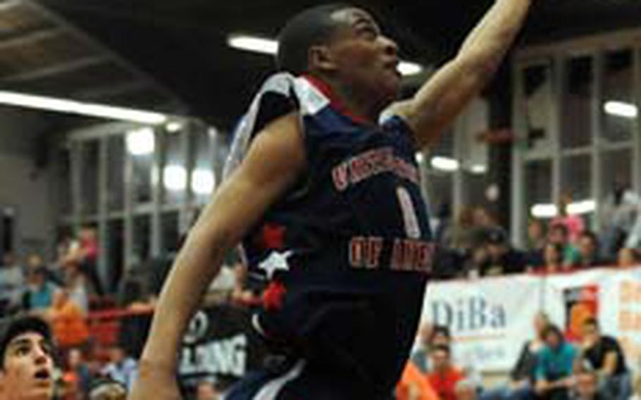 Damian Leonard of the United States sails to the basket for a layup in the Americans&#39; 91-81 victory over Spain at the Albert Schweitzer International Youth Basketball Tournament on Wednesday night. Leonard scored 19 points in the game.