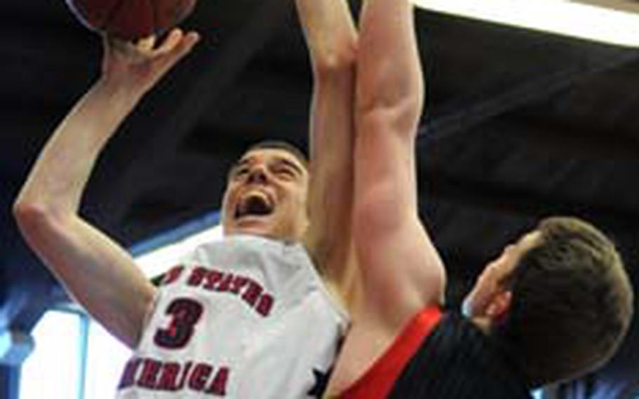 Marshall Plumlee of the United States takes it to the hoop against Germany's Paul Albrecht, and is fouled. Plumlee made the two free throws, but the U.S. lost to Germany's Under-17 team 79-68 in the third place game of the Albert Schweitzer International Youth tournament in Mannheim, Germany, on Saturday.