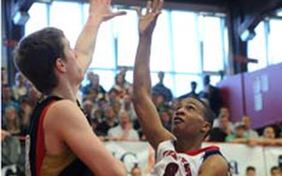 Damian Leonard of the United States lofts a shot over Germany&#39;s Jakob Krumbeck. Leonard, along with Ryan Boatright, led all scorers with 18 points, but the U.S. lost to Germany&#39;s Under-17 team 79-68 in the third- place game at the Albert Schweitzer International Youth tournament in Mannheim, Germany, on Saturday.