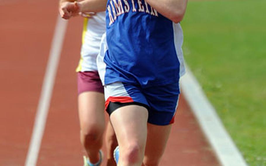 Above: Ramstein’s Elizabeth Doe, front, won the girls 3,000-meter race in 11 minutes, 40.62 seconds, ahead of Frankfurt International School’s Natalie Pecoraro in a meet in Ramstein, Germany, on Saturday.