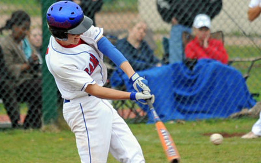 Ramstein’s Matt McDonald connects with a run-scoring sacrifice fly that went to the fence in the Royals’ 8-5 victory over SHAPE at home on Saturday.