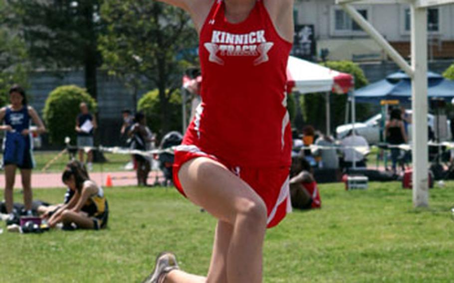 Kinnick freshman Megan Cooney competes in the long jump in the Kanto Plain Association of Secondary Schools track and field championship on Saturday at Yokota’s Bonk Field. Cooney placed fourth at 4.38 meters.