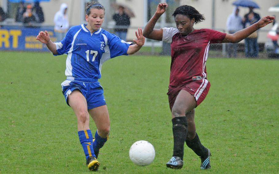 Wiesbaden&#39;s Celina Ponte, left, and Vilseck&#39;s Josie Rodriguez fight for the ball in the season-opener for both teams on March 27. Both teams are in the same Division I  pool and will meet Wednesday, opening day for the 2010 DODDS-Europe soccer championships.