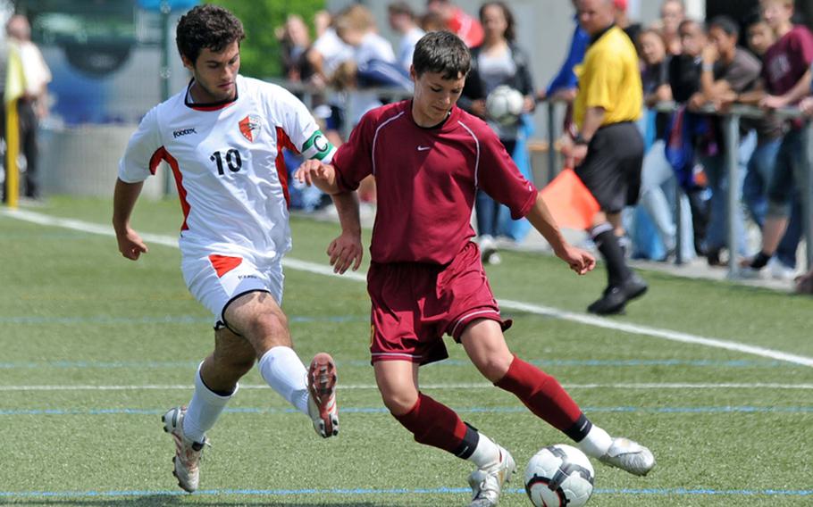 American Overseas School of Rome&#39;s Giacomo Castelli, left, tries to steal the ball from Baumholder&#39;s Alexander Shadrin in a boys Division II semifinal game in the DODDS-Europe boys soccer tournament Friday. AOSR won the game 6-0.

Michael Abrams/Stars and Stripes