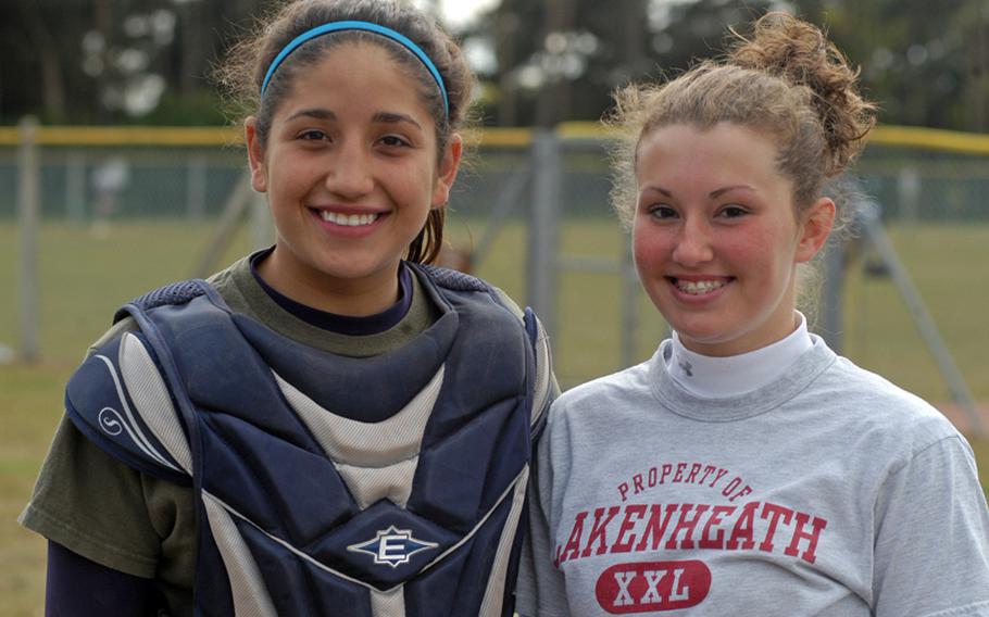 Seniors Nicole McBride, left, and Ali Parkerson have played varsity softball together since they were freshmen. This year they are co-captains, following in the footsteps of their sisters who were also team captains at Lakenheath.