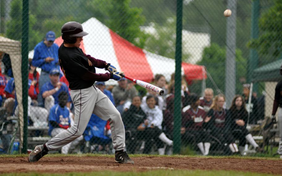 Vilseck third baseman Jake Blackburn hits a single to left field to drive in a run during the top of the fourth inning of a game against Kaiserslautern on the first day of the DODDS-Europe Division I baseball tournament at Ramstein Air Base, Germany, on Thursday. Kaiserslautern won 10-2.
