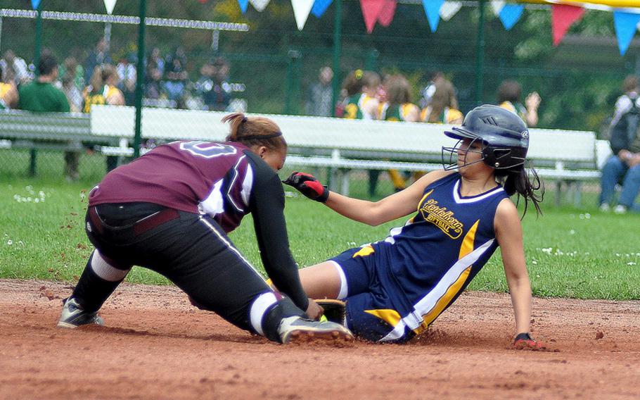 Vilseck shortstop Deraj McClinton tags out Heidelberg's Lexi Tarvarez during the first day of of the DODDS-Europe Division I softball tournament on Thursday at Ramstein High School, Germany, as she tried to stretch her hit into a double. Vilseck won 8-5.