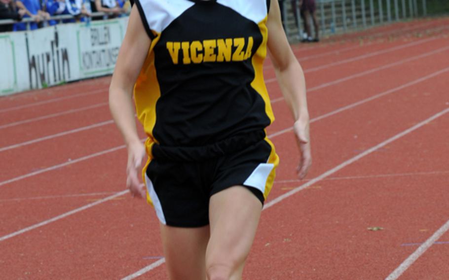 Vicenza's Penny Boswell is all by herself, leading the field by about a half lap, in winning the girls 3,000-meter run in 10 minutes, 49.38 seconds on the first day of the DODDS-Europe Track and Field Championships at the Rüsselsheim, Germany,  stadium. Second was Elizabeth Doe of Ramstein  in 11:16.47. Third was Ashley Santos of Kaiserslautern in 11:18.92.