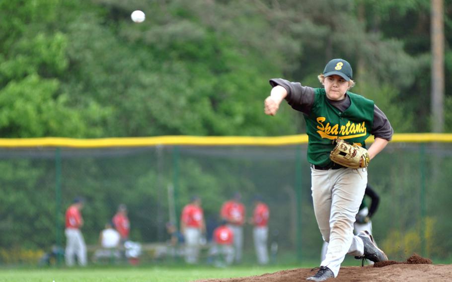 SHAPE relief pitcher James Workman throws a strike in the top of the first inning during a semifinal game against Ramstein in the Division I baseball tournament Friday on Ramstein Air Base, Germany. Ramstein won the semnifinal game 24-5.