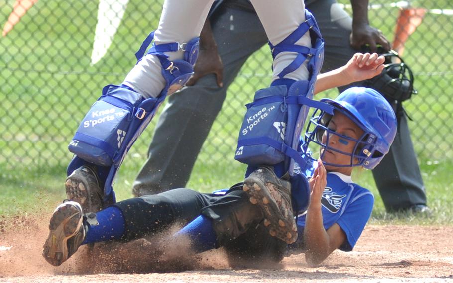 Incirlik third baseman Kyara Nieves slides into home safely in the top of the second inning of the DODDS Europe Division III softball championship game against Rota on Saturday. Rota won the game, 16-12. 