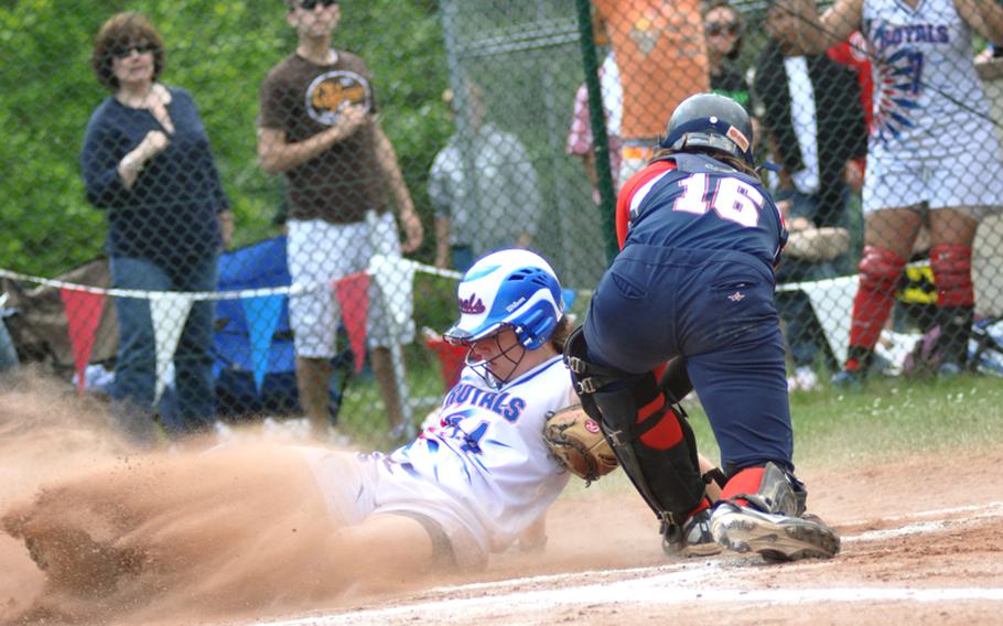 Ramstein&#39;s Kayla Pahls slides home safely past Lakenheath catcher Nicole McBride during the DODDS-Europe Division I softball championship game at Ramstein High School on Saturday. Ramstein won, 5-1.