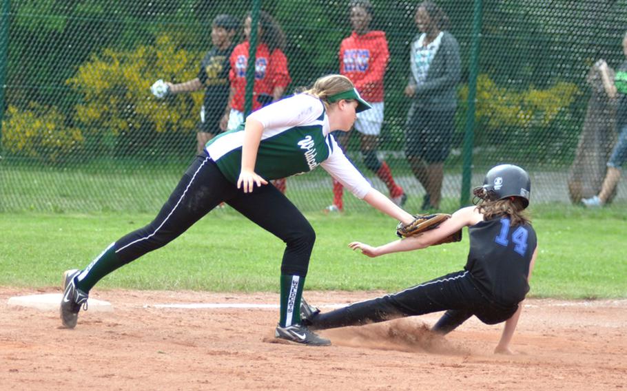 Naples third baseman Alley Ward tags out Hohenfels' Casey Leon during the DODDS-Europe Division II softball championship game at Ramstein High School on Saturday. Naples won, 6-0.