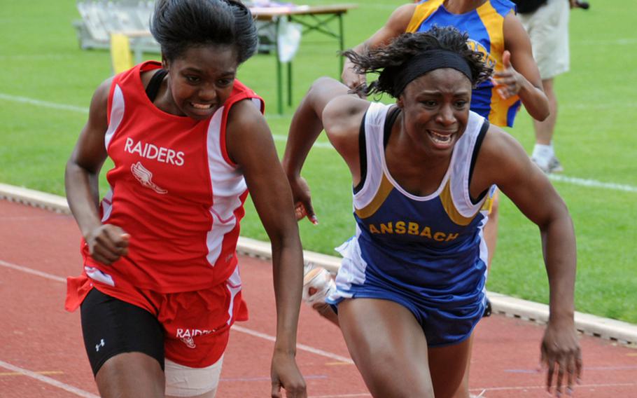 Shaun Pri of Kaiserslautern edges out Tiffany Heard of Ansbach by .02 seconds at the finish line of the 200 meter dash.

