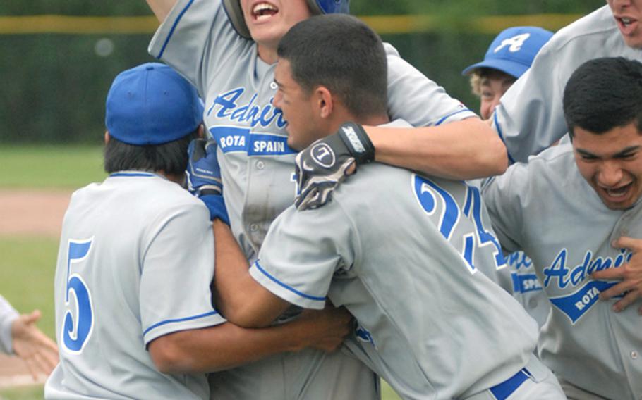 ROTA players celebrate their victory Saturday at the European high school baseball championships. ROTA defeated Naples, 4-3.