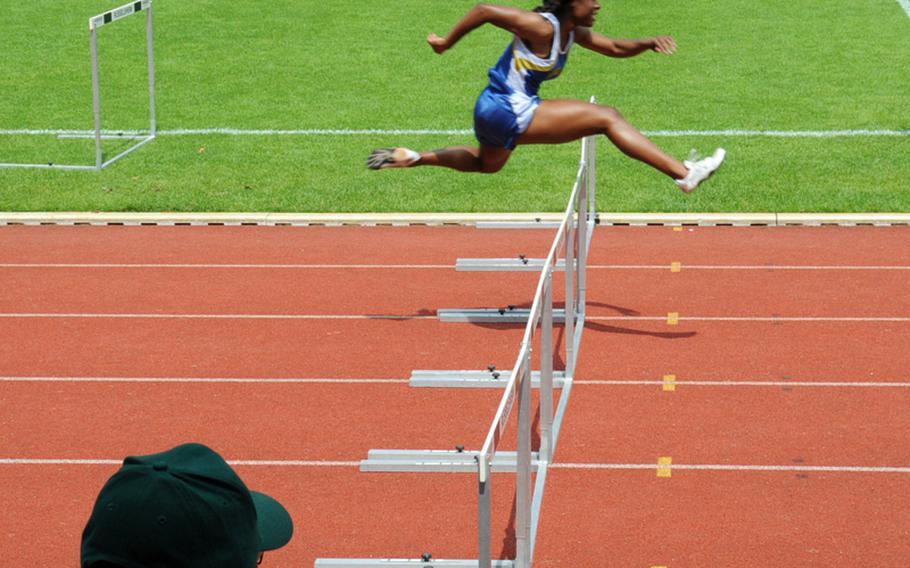 Tiffany Heard wins her third gold medal with a victory in the girls 300 meter hurdles at the 2010 DODDS-Europe Track and Field Championships. Her time of 45.69 was more than three seconds better than the runner-up.