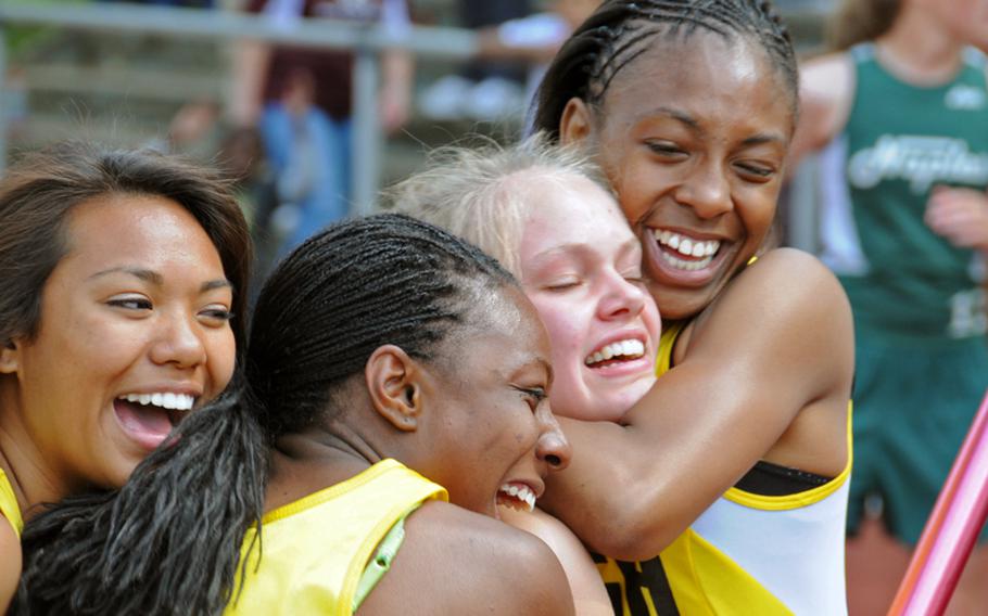The Patch girls 1,600 sprint medley team celebrates its victory in the the DODDS-Europe Track and Field Championships on Saturday. From left are Abby Diaz, Kristin Robinson, Cass Bush (who ran the final leg) and Shy Alexander, who won in 4:23.48. Vilseck was second in in 4:25.9 and Naples third in 4:28.90.