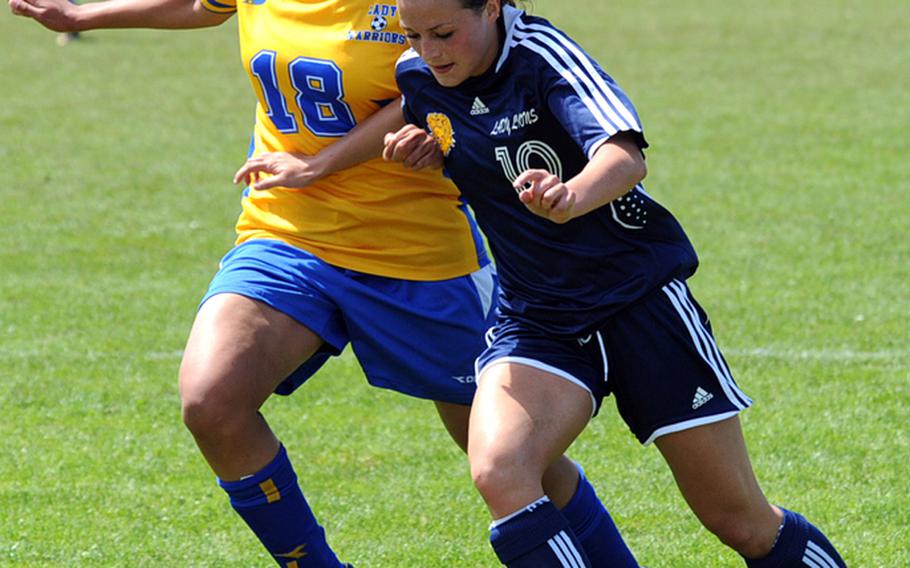 Heidelberg&#39;s Maggie Cutler, right, drives the ball against Wiesbaden&#39;s LeAndra Thomas in a girls Division I semifinal game at the DODDS-Europe soccer finals in May. Cutler was selected to the 2010 All-Europe girls team.