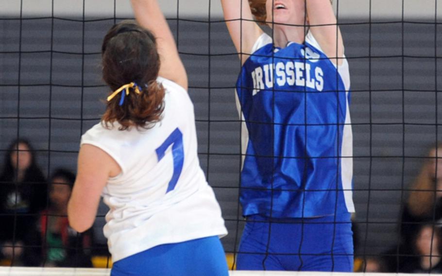Kathleen Anderson of Brussels, right, prepares to block a hit by Sigonella's Rae Burgess in the Division III final of the DODDS-Europe volleyball championships in Ramstein in November. Anderson was chosen as the 2010 DODDS female athlete of the year.