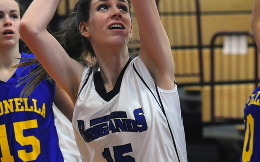 Brussels' Kathleen Anderson aims for the basket in Division III action in the DODDS-Europe basketball championship tournament in February. Anderson was named the 2010 DODDS female athlete of the year.